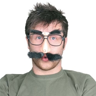 A classic  music-hall style comedy prop. The large lens-free spectacles have a giant nose attached  