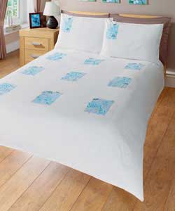 Plain dyed bedding with patchwork design featuring floral detailing with dragonflies.Set contains