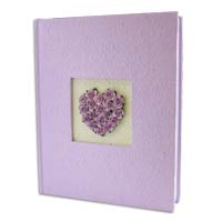 Beautifully bound in handmade paper with a heart m