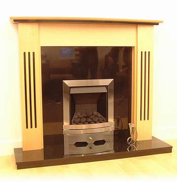 Maple veneer surround.
Natural Black Granite Backpanel & 54`` Black Granite Hearth.
Slimline