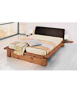 Sturdy solid pine bed in new continental design with faux leather headboard and 2 clip-on bedside ta