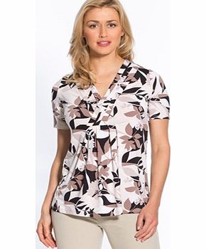 This really comfortable Printed T-shirt with Crossover V-Neckline is stunning in a tunic shirt style! Youll love the stylish cut that flatters all body shapes. It has a crossover V-neckline accentuated with three layered bands and seaming under the b